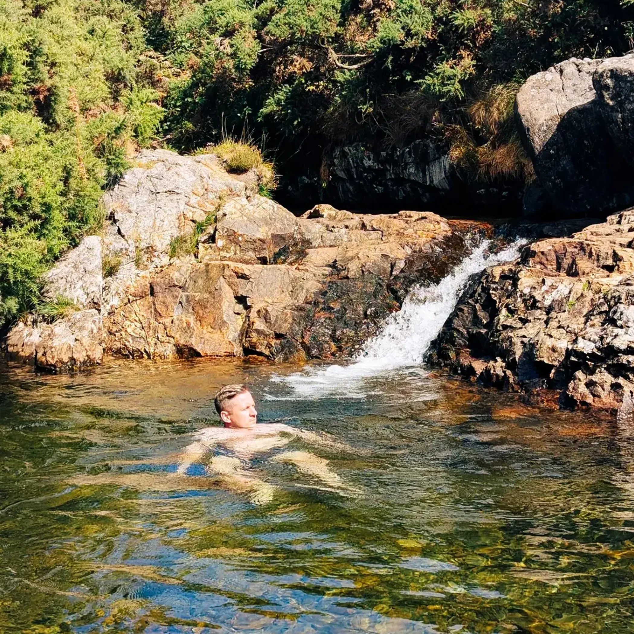 people swimming in a river